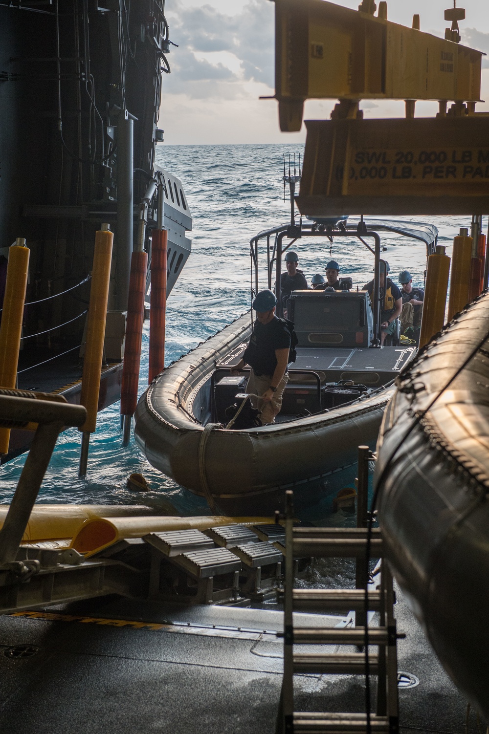 US Navy divers prepare to operate tow fish side scan sonar