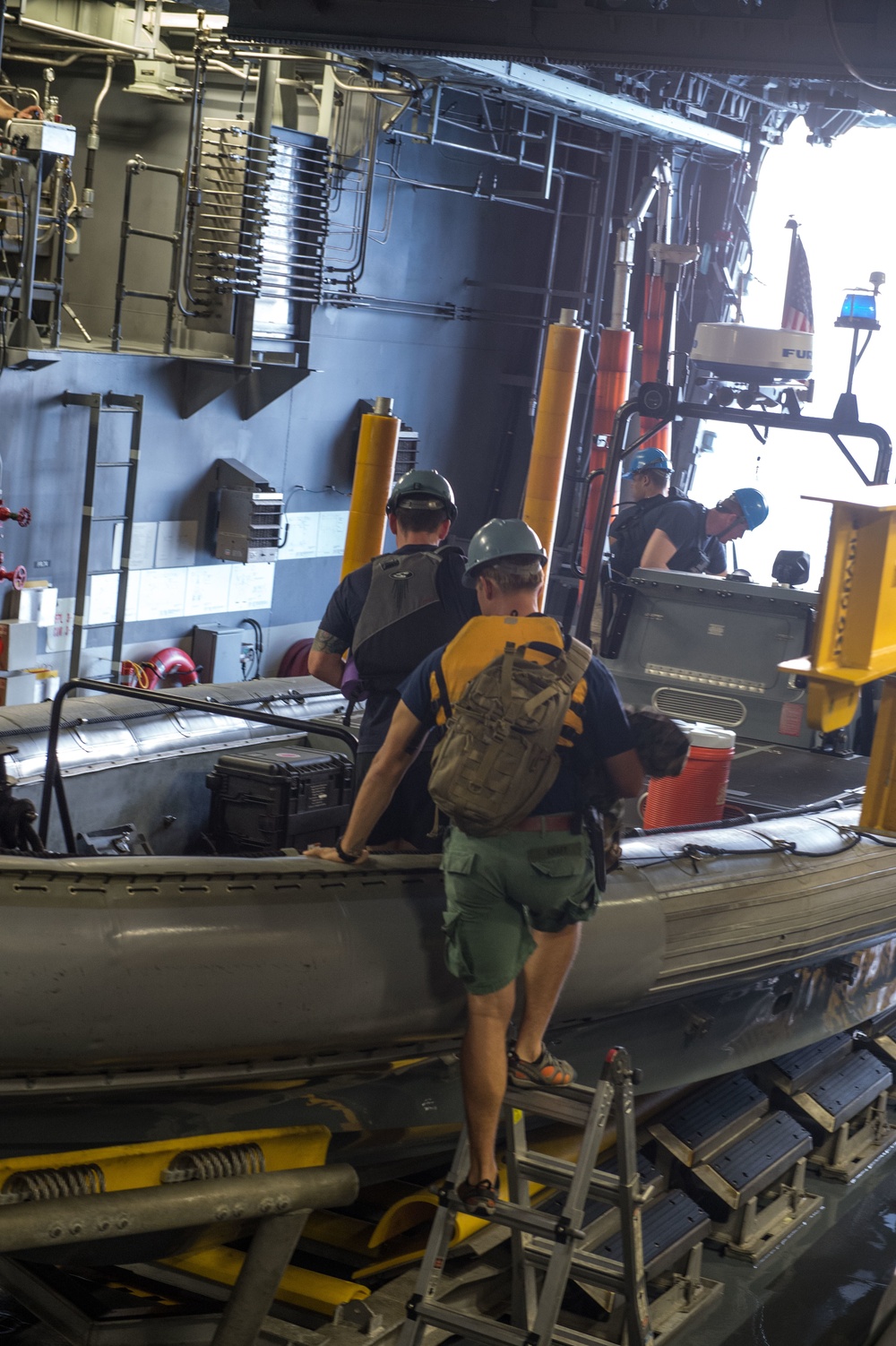 US Navy divers prepare to operate tow fish side scan sonar