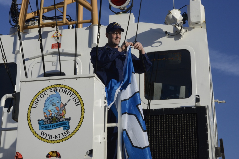 CGC Swordfish raises Seahawks flag