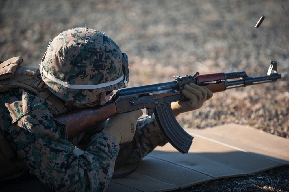 A United States Marine fires an AK-47