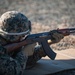 A United States Marine fires an AK-47