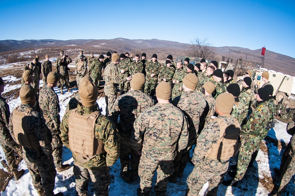 United States Marines and Bulgarian soldiers gather together