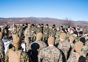 United States Marines and Bulgarian soldiers gather together