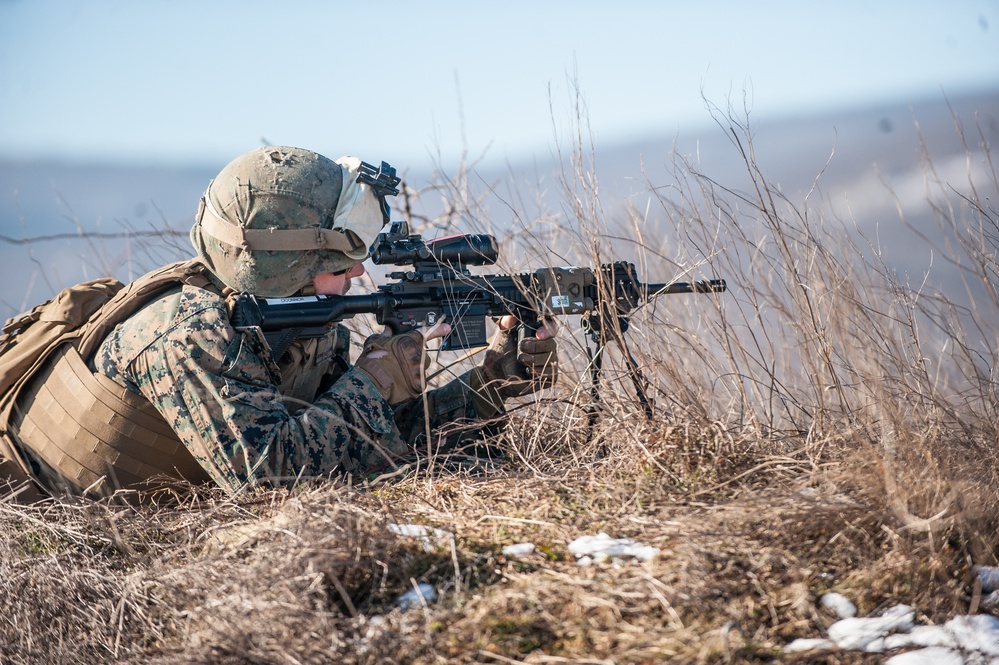 A United States Marine simulates fire