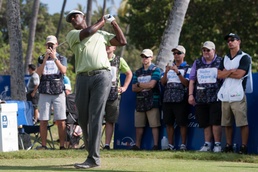 US military service members caddie for pro golfers during Sony Open in Hawaii Pro-Am Tournament