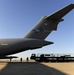 728th Air Mobility Squadron members process cargo from a C-17 Globemaster III