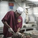 USS Harry S. Truman Sailor prepares roast beef