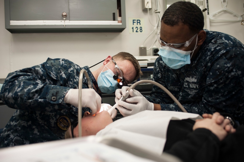 USS Harry S. Truman Sailor receives dental exam