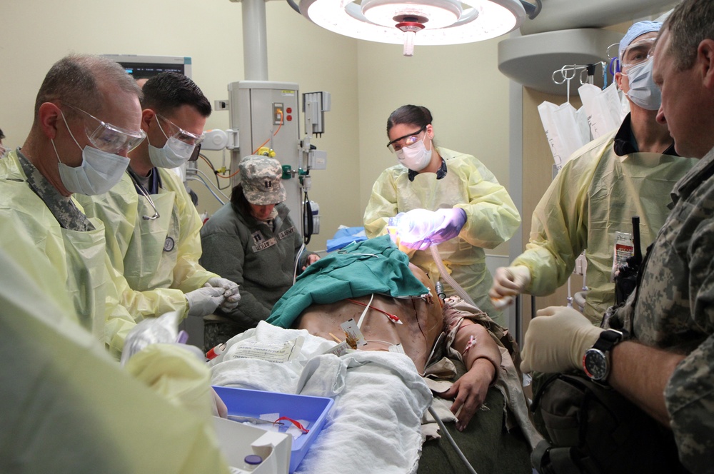 Fort Belvoir emergency room personnel train on the cut suit