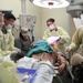 Fort Belvoir emergency room personnel train on the cut suit