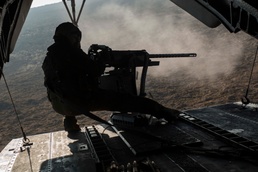 Marines fire machine guns from Super Stallions