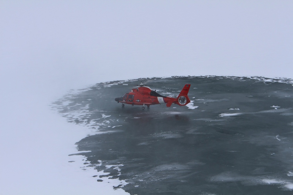 Coast Guard helicopter lands on frozen lake