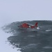 Coast Guard helicopter lands on frozen lake