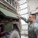 Opening the hose on Army fire truck maintenance