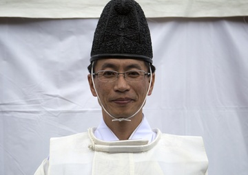 Shinto priest blesses new school construction grounds