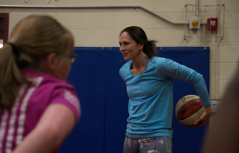 Sue Bird gets hands-on with military children in free basketball clinic