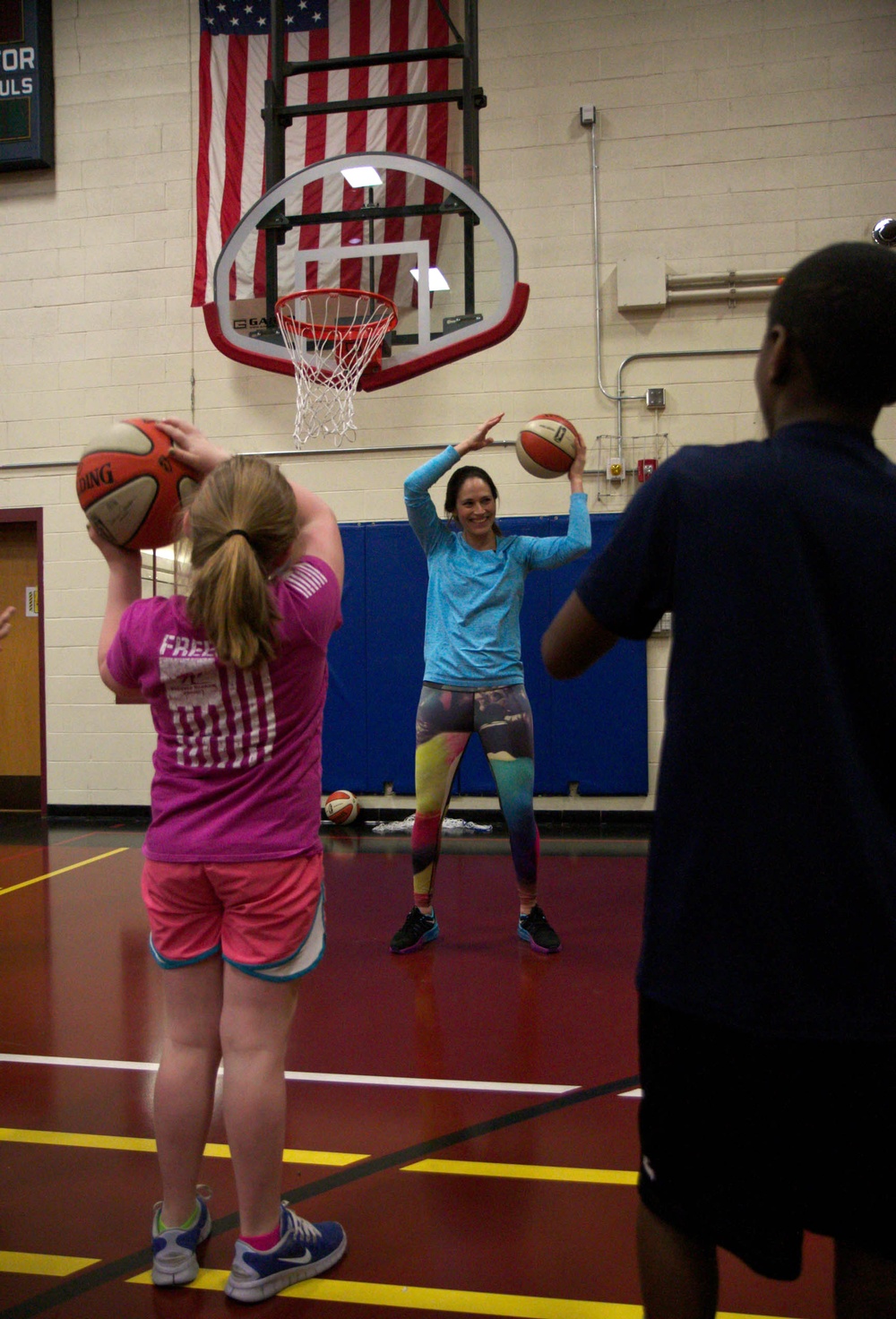 Sue Bird gets hands-on with military children in free basketball clinic