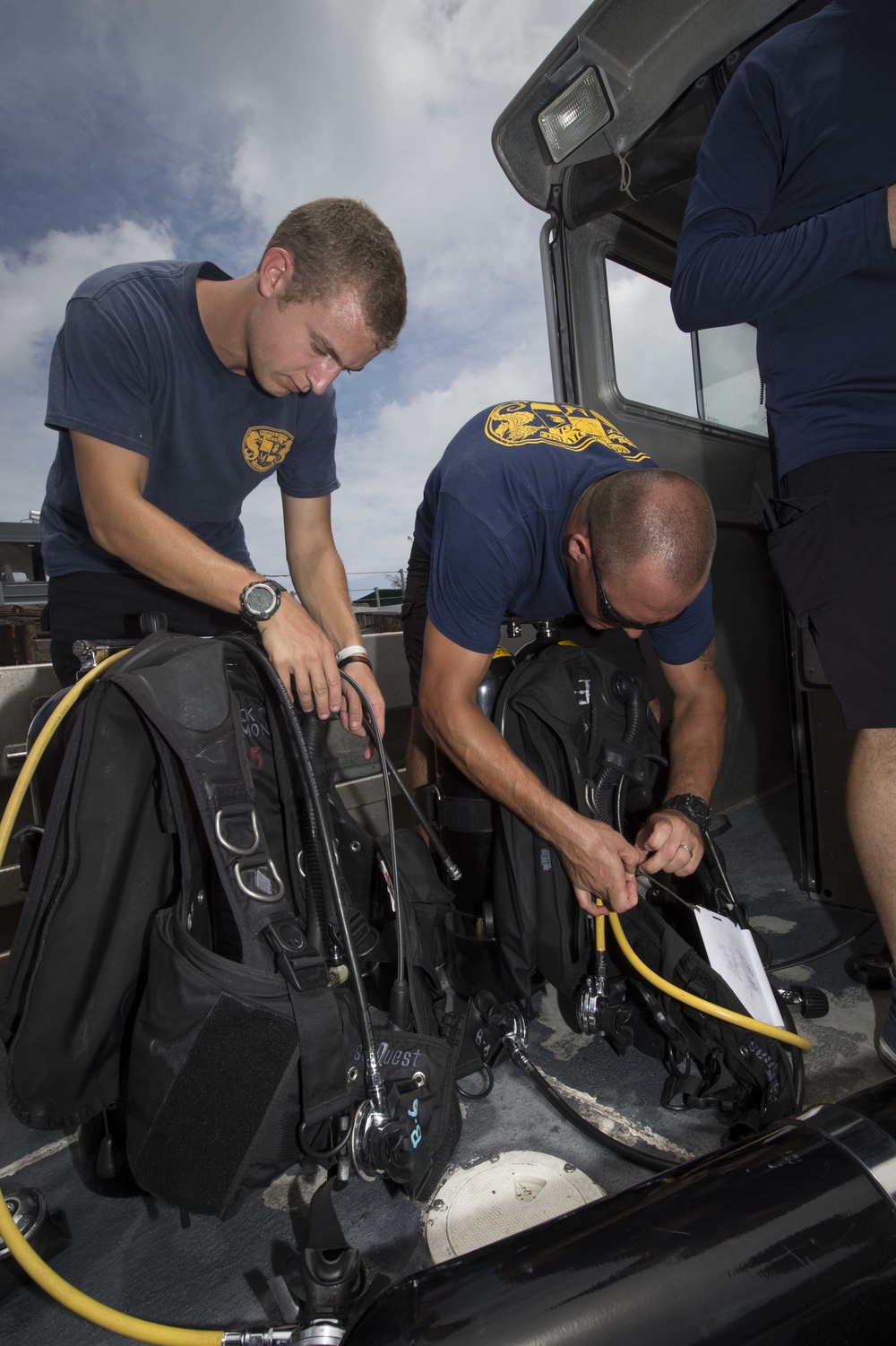 Underwater Construction Team (UCT) Two, Navy Divers from Mobile Diving and Salvage Unit (MDSU) One.
