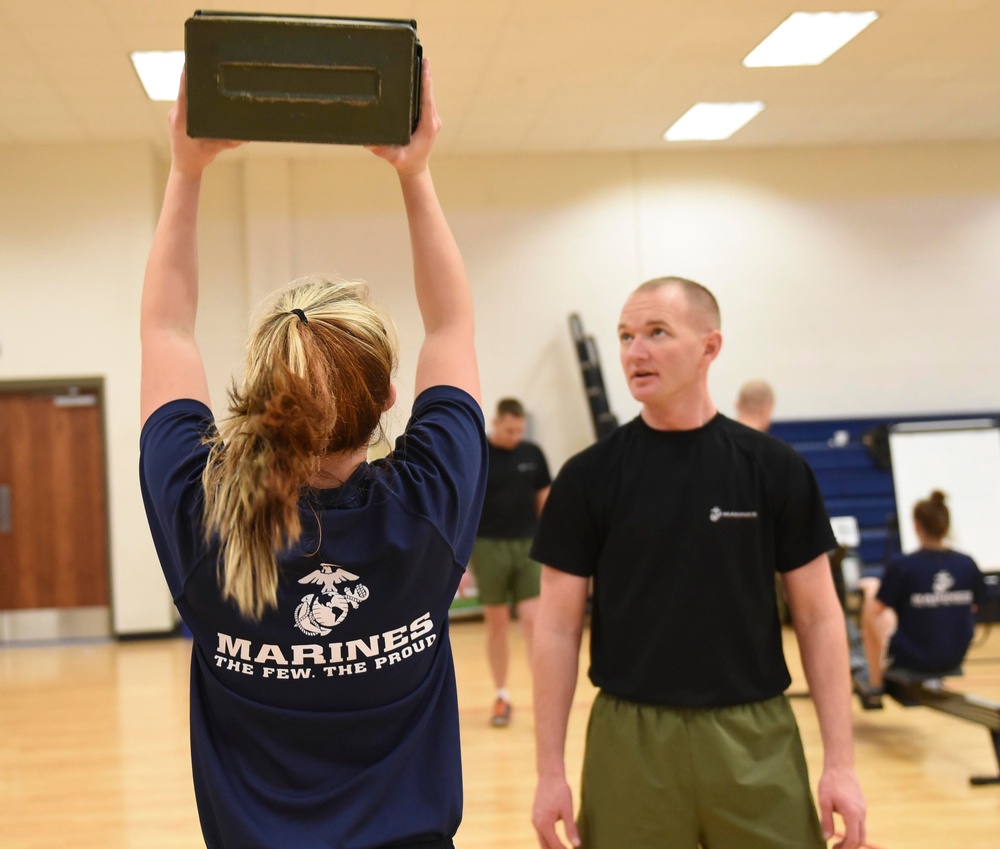Female U.S. Marine Corps poolees endure DEP workout