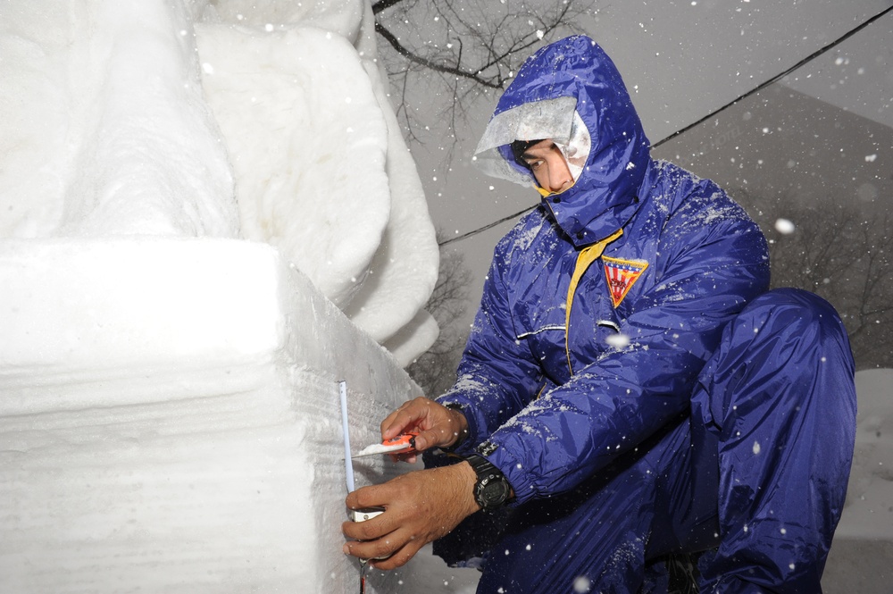 Misawa sailors create USS Constitution snow sculpture