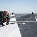 USS George H.W. Bush sailor removes ice