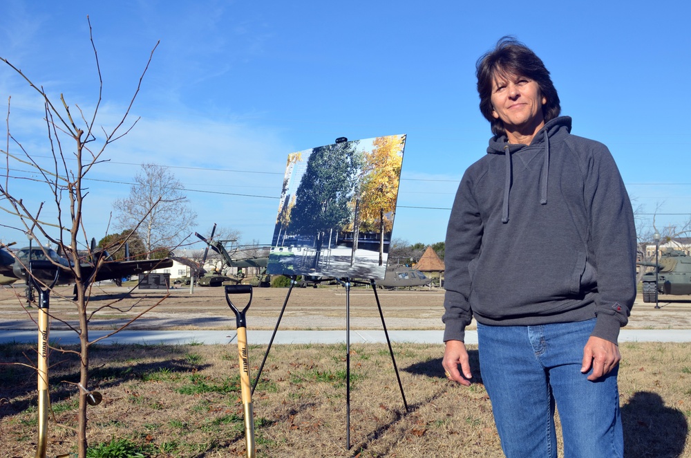 Community tree planting represents resiliency, strength