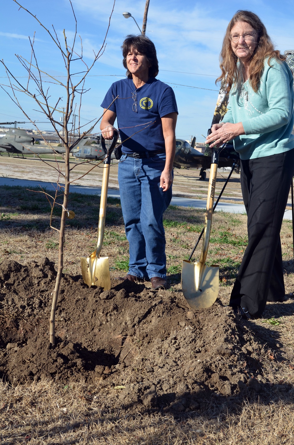 Community tree planting represents resiliency, strength