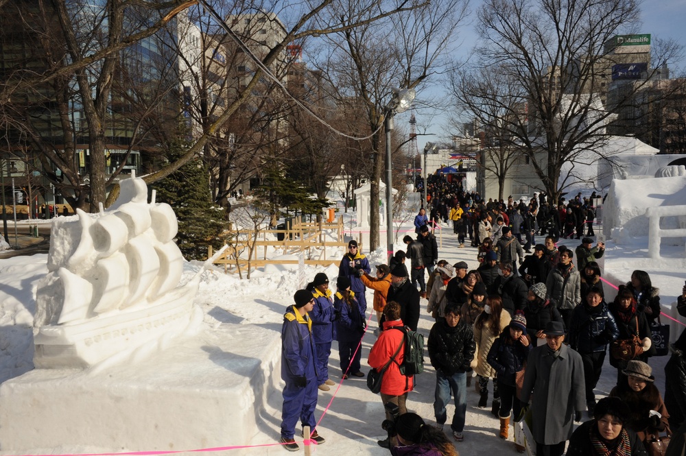 2015 Navy Misawa Snow Team creates USS Constitution snow sculpture during the 66th Annual Sapporo Snow Festival