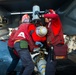 USS Carl Vinson Sailors load ordnance