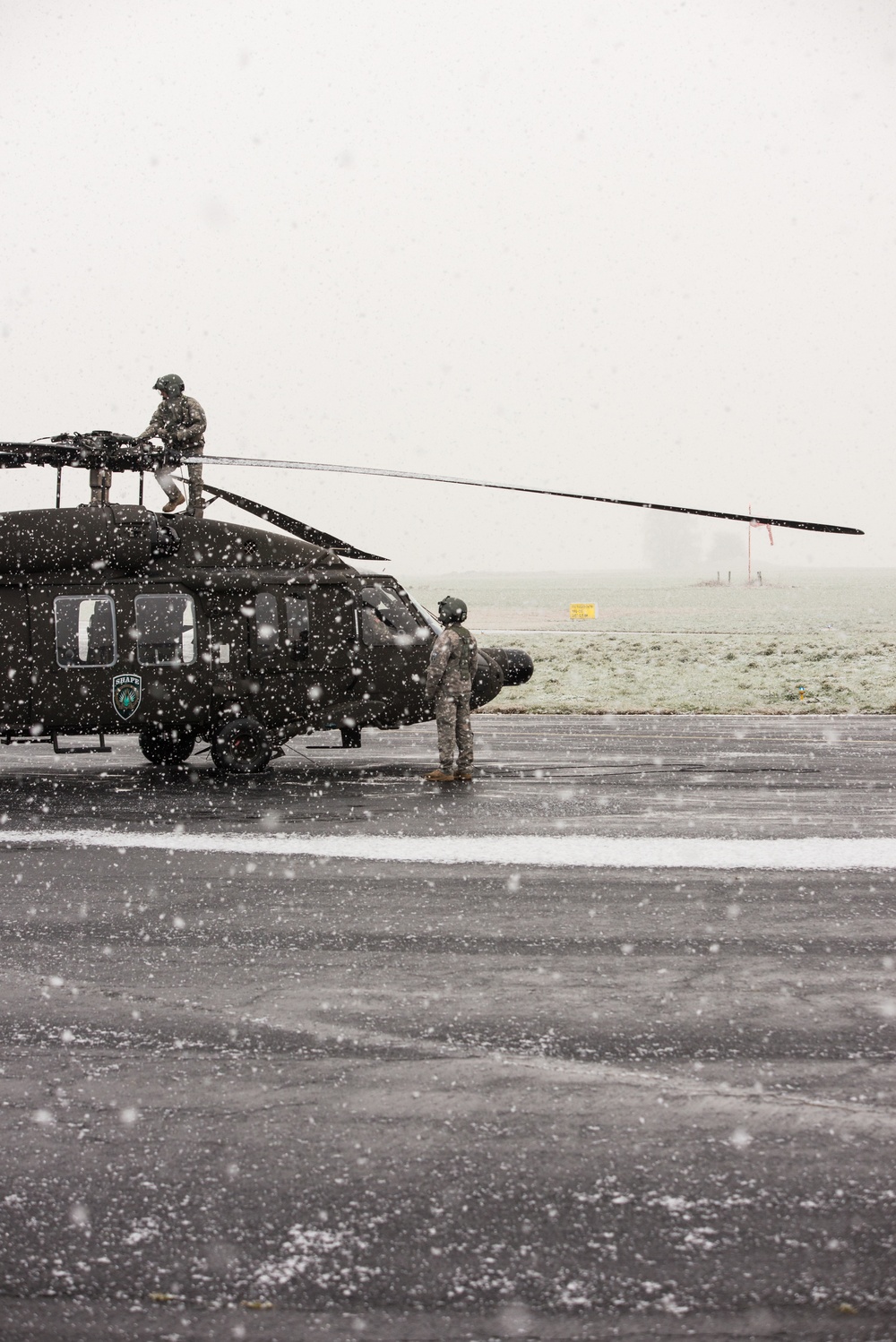 UH-60A Black Hawk Helicopter pre-flight checks and take off in the snow