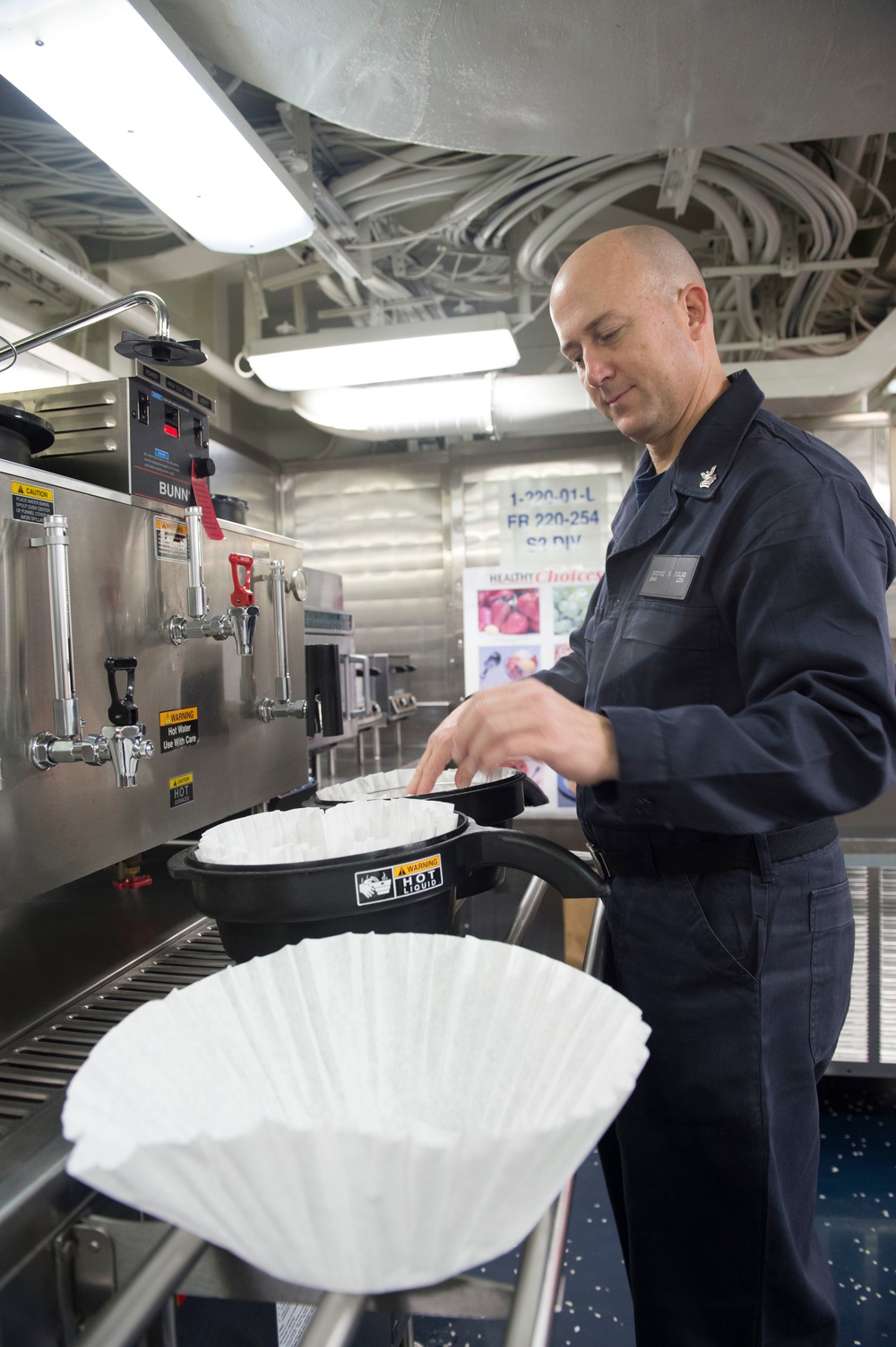 Boatswains mate first class prepares coffee