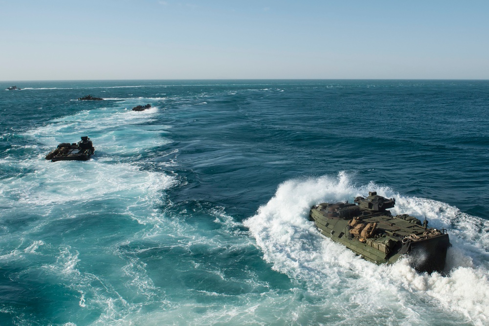 Amphibious assault vehicles launch from USS Fort McHenry