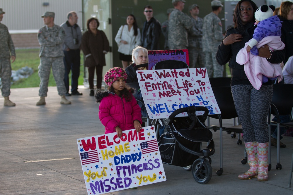 Family and friends gather to welcome Soldiers from the 787th Ordnance Company home from deployment