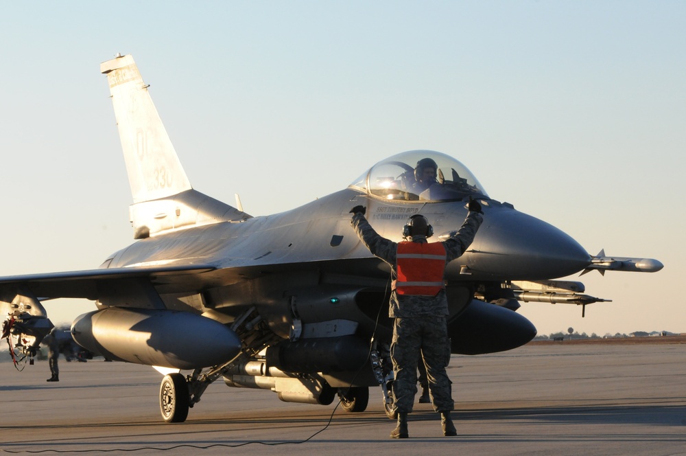 113th Wing crew chief prepares an F-16C for launch