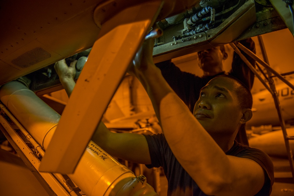Sailors conduct aircraft maintenance aboard USS Carl Vinson