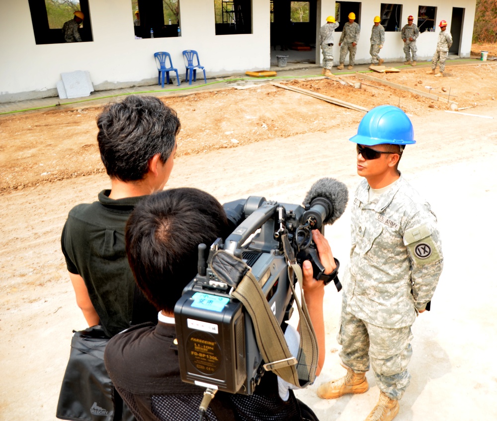 Sgt. 1st Class Jeremiah Flores Diaz answers questions during an interview with a Japanese news outlet in Lop Buri, Thailand during Exercise Cobra Gold, Feb. 13