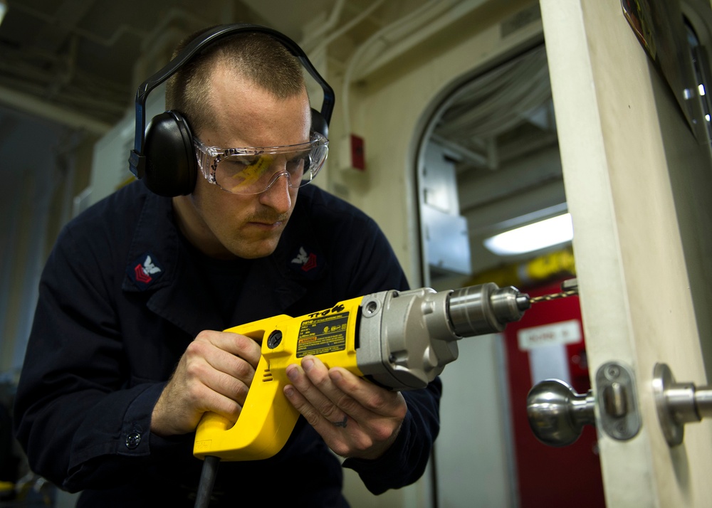 Maintenance aboard USS America