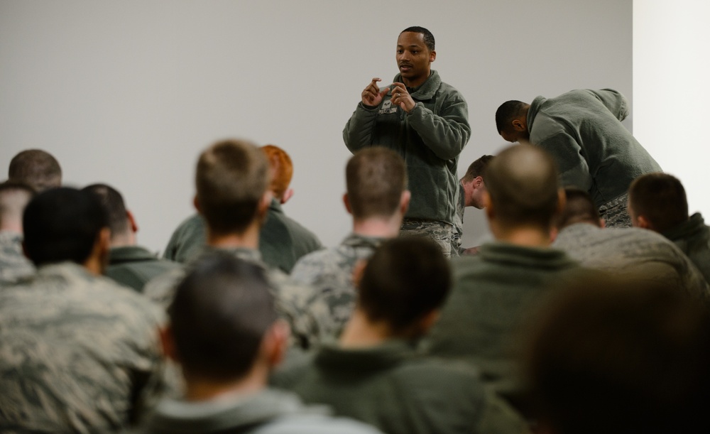 Airmen lay out map for fellow engineers
