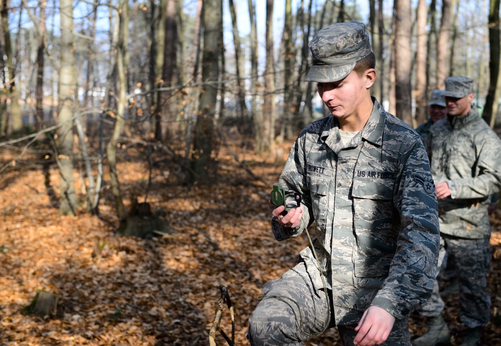 Airmen lay out map for fellow engineers