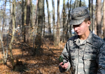 Airmen lay out map for fellow engineers