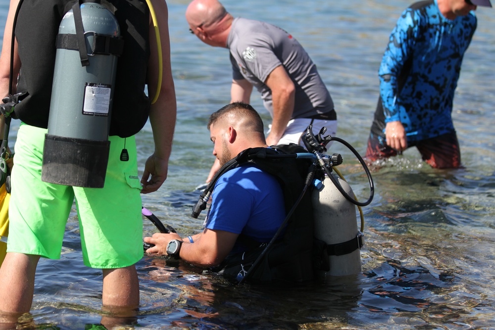 Disabled veteran Sammy Lugo dives in Guantanamo Bay, Cuba