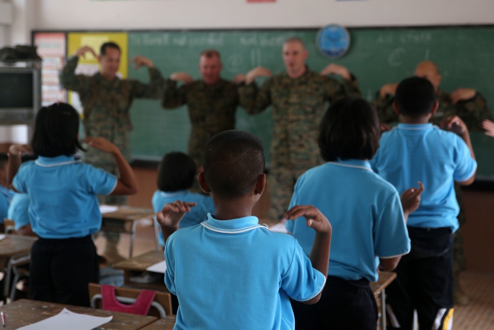 Service members, laugh, play, learn with Thai children during Cobra Gold 15