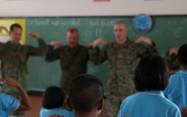 Service members, laugh, play, learn with Thai children during Cobra Gold 15