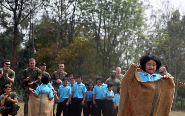 Service members, laugh, play, learn with Thai children during Cobra Gold 15