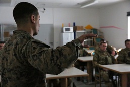 U.S. Marine briefs Georgian soldiers during the Situational Training Exercise