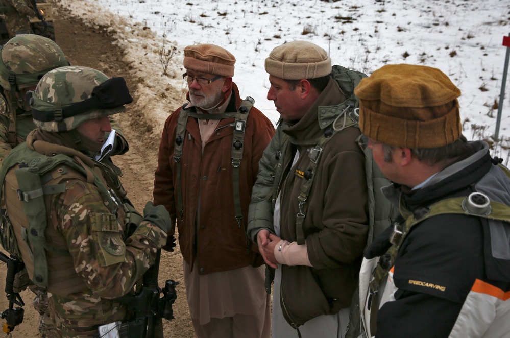 Georgian soldiers interact with simulated Afghan locals during the Situational Training Exercise