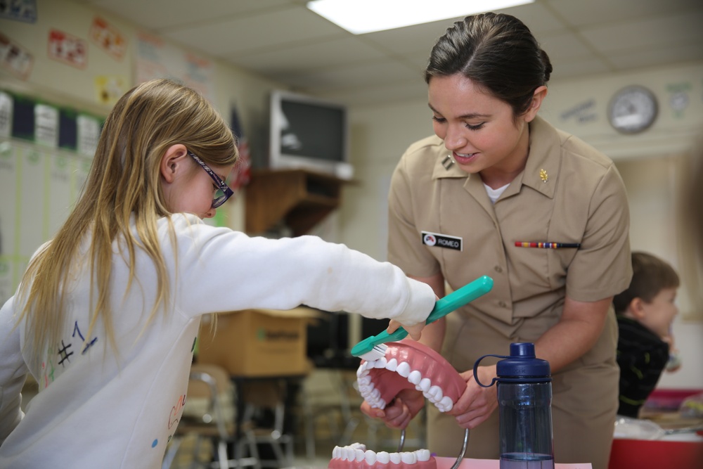 Sailors, students share smiles during oral hygiene visit