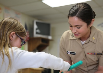Sailors, students share smiles during oral hygiene visit