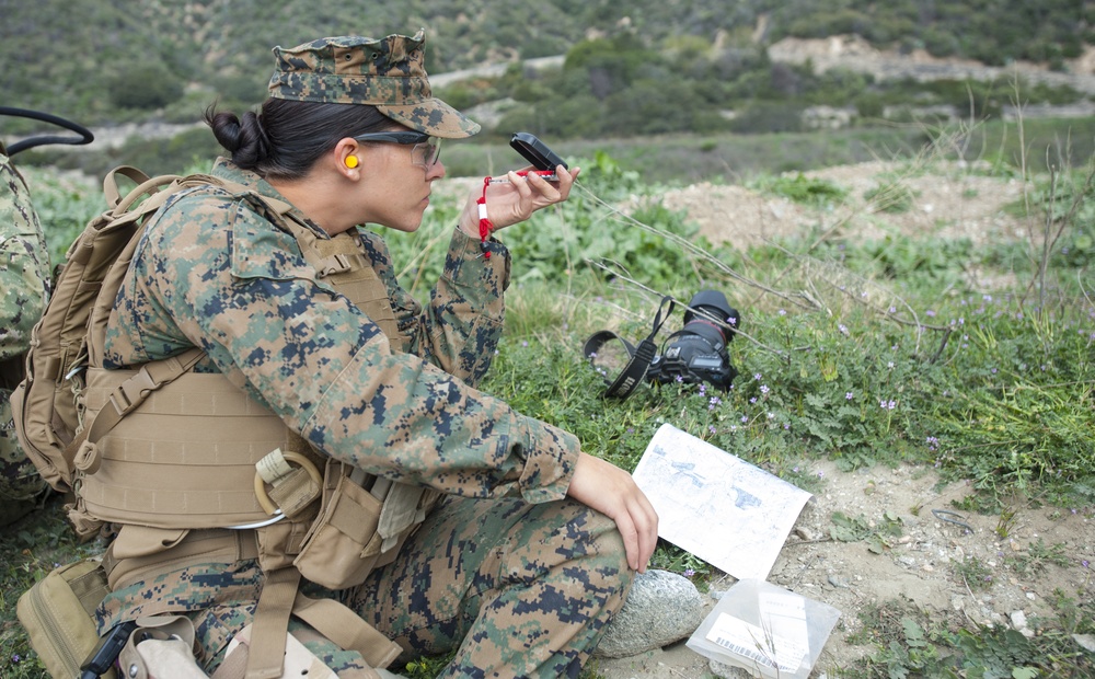 US military combat cameramen practice navigation techniques