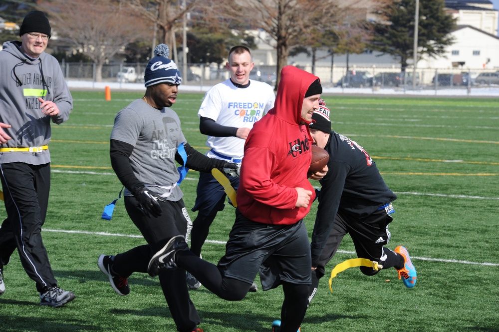 Sailors and Airmen compete in the Third Annual Misawa Air Base Snow Bowl Flag Football Tournament